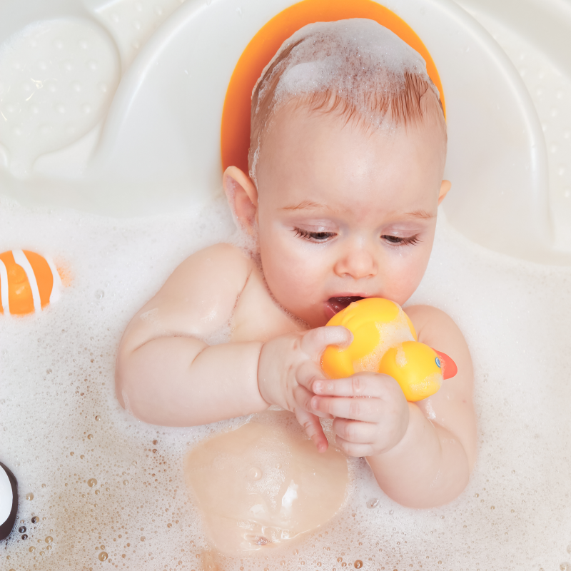 Baby bath time with bubbles and yellow duck