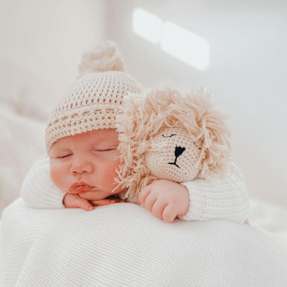 Baby sleeping with Lion comforter