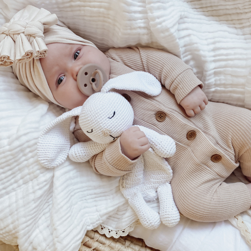 Beautiful baby posing with Cuddle Me Bunny