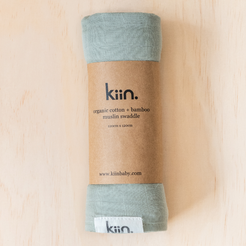 Kiin Swaddle Sage rolled in packaging