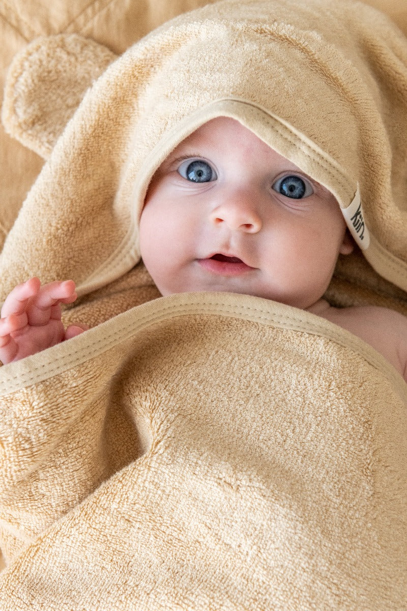 Baby wrapped in Oat Hooded Towel