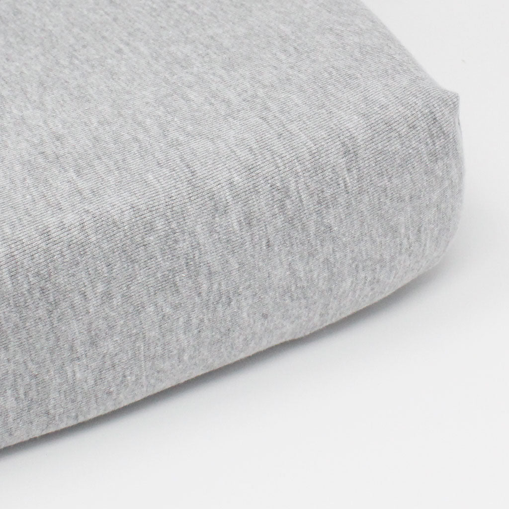 Grey Melange Fitted Cot Sheet on mattress