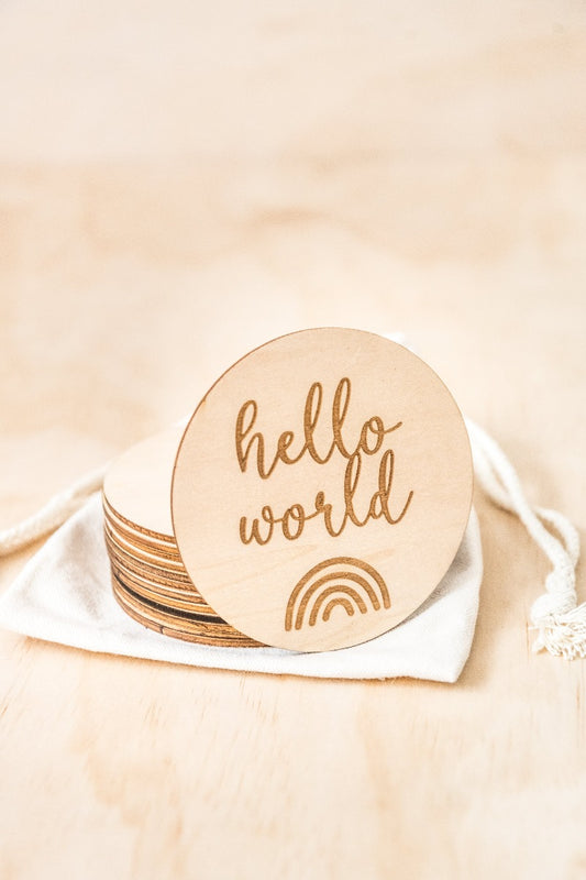 Kiin Baby Wooden Milestone Discs out of packaging with hello world as the first disc
