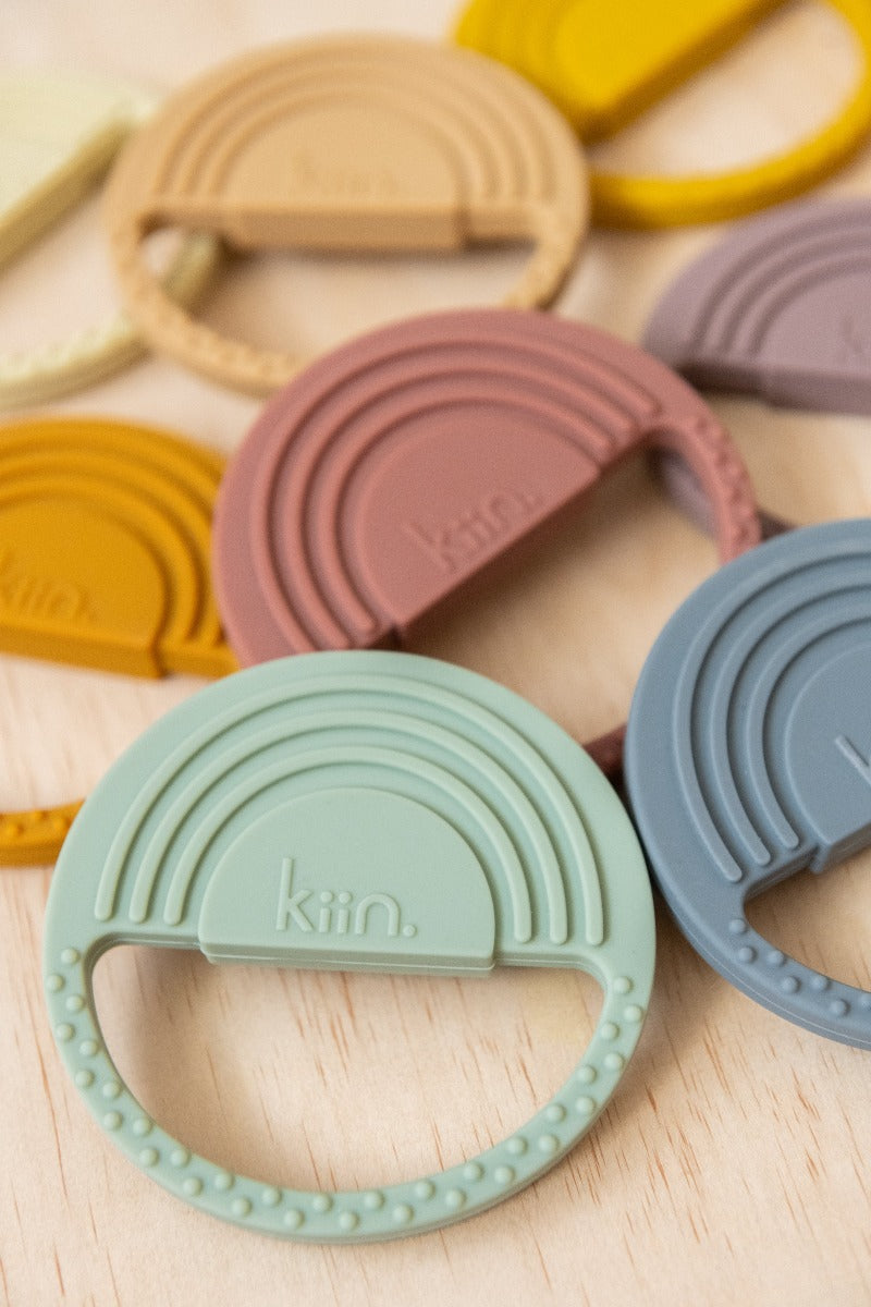 Kiin Baby Silicone Rainbow Teether showing full range colours