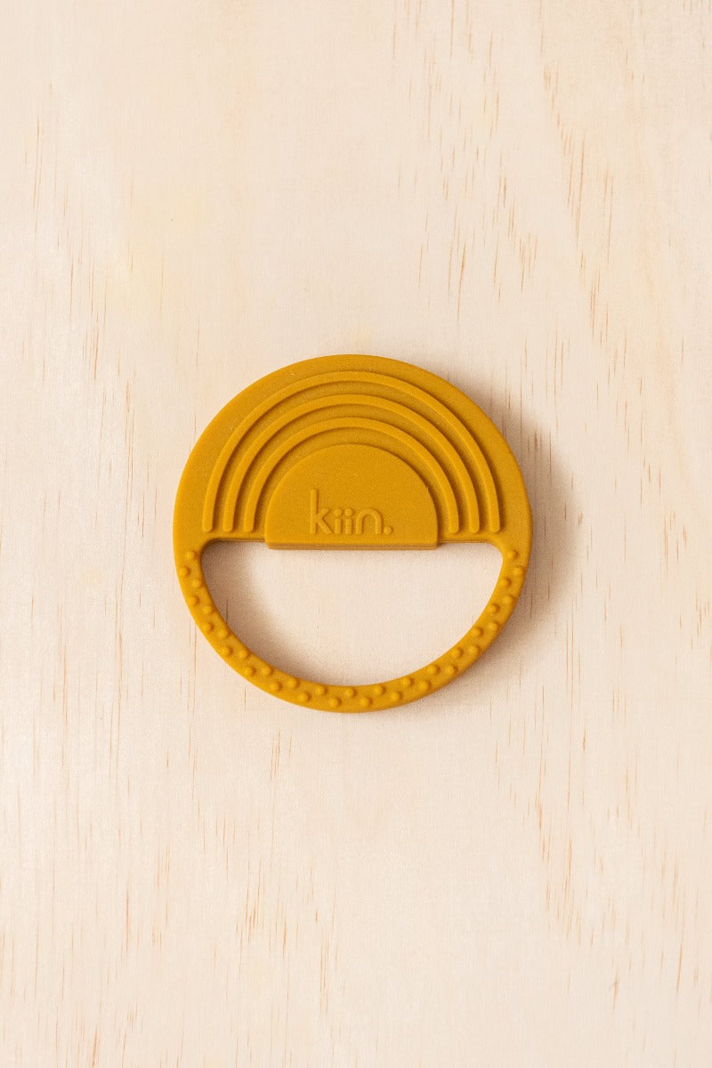 Kiin Baby Silicone Rainbow Teether in Copper colour out of packaging