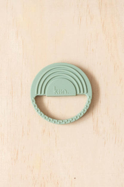 Kiin Baby Silicone Rainbow Teether in Sage colour out of packaging